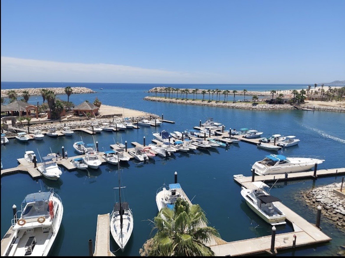 Marina with boats and ocean beyond