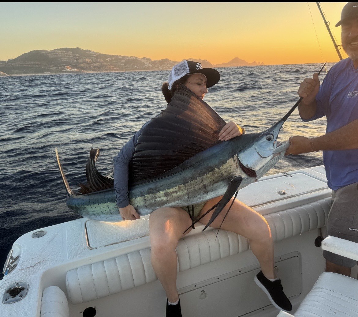Sailfish catch at sunset on the water