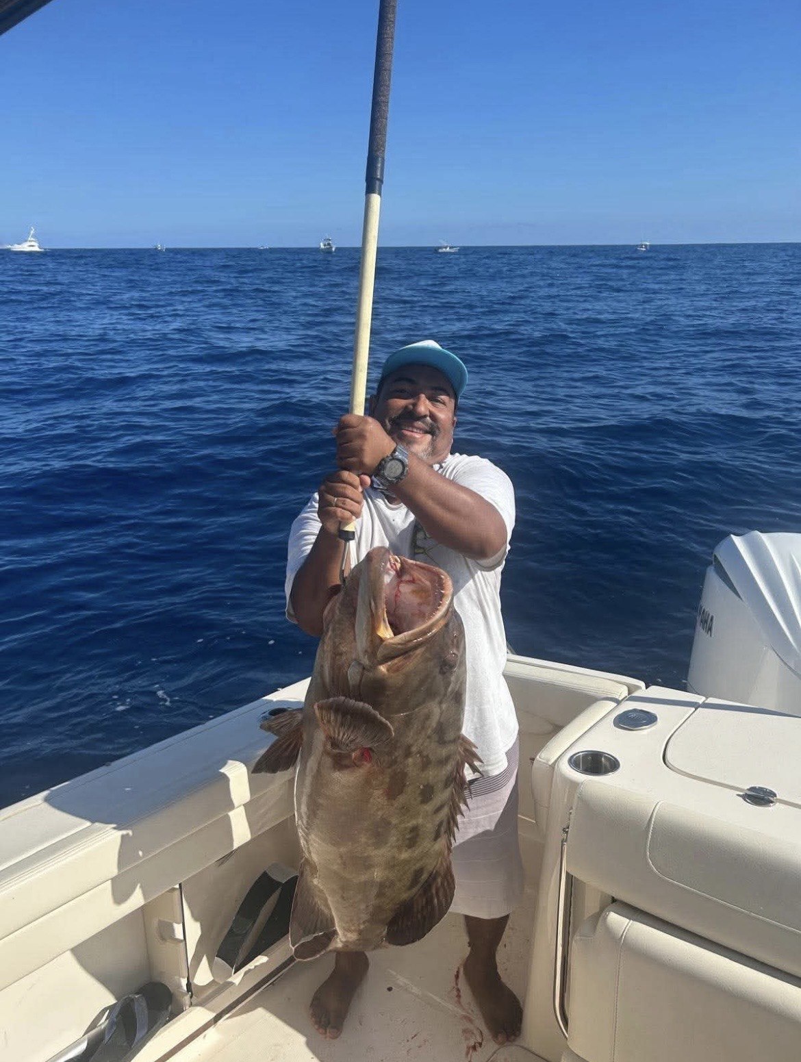 Angler with a catch on the water